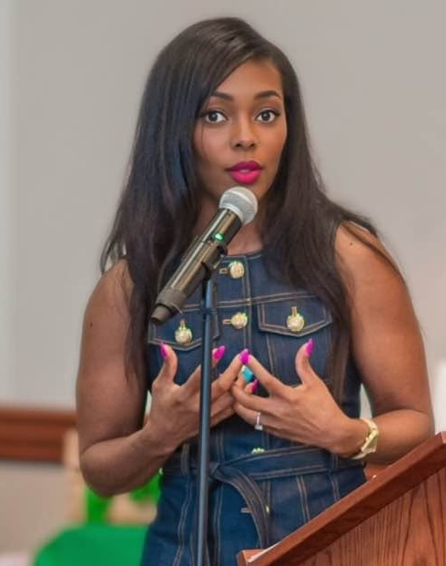 Dr. Nichelle Chandler speaking at a podium